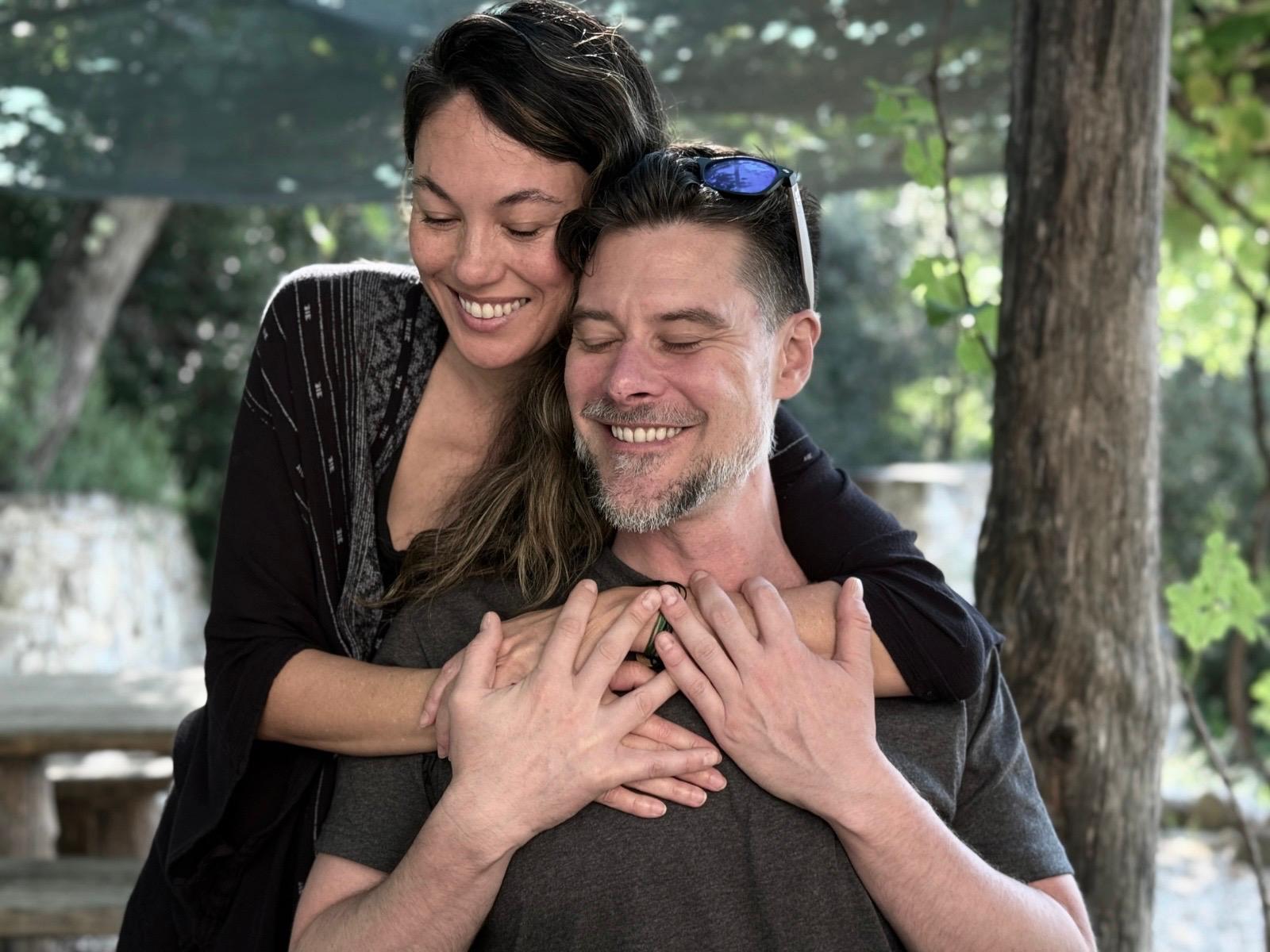 Cover image of The Bridge Alliance Path retreat, two participants embracing outdoors