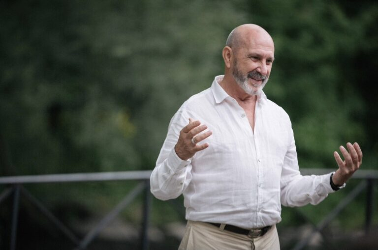 Cover image of The Bridge Legacy Path retreat, the facilitator speaking to the participants outdoors